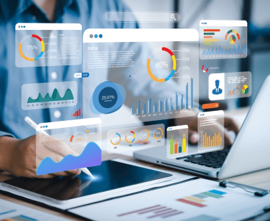 A businessperson on a laptop with digital symbols representing different metrics and data points overlaid on the image.